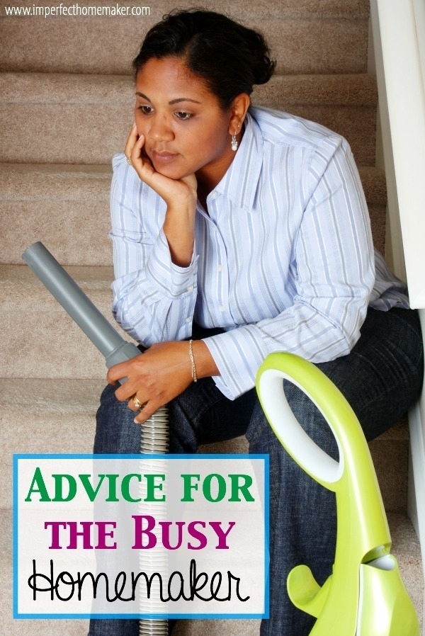 Woman cleaning in her house with a vacuum cleaner