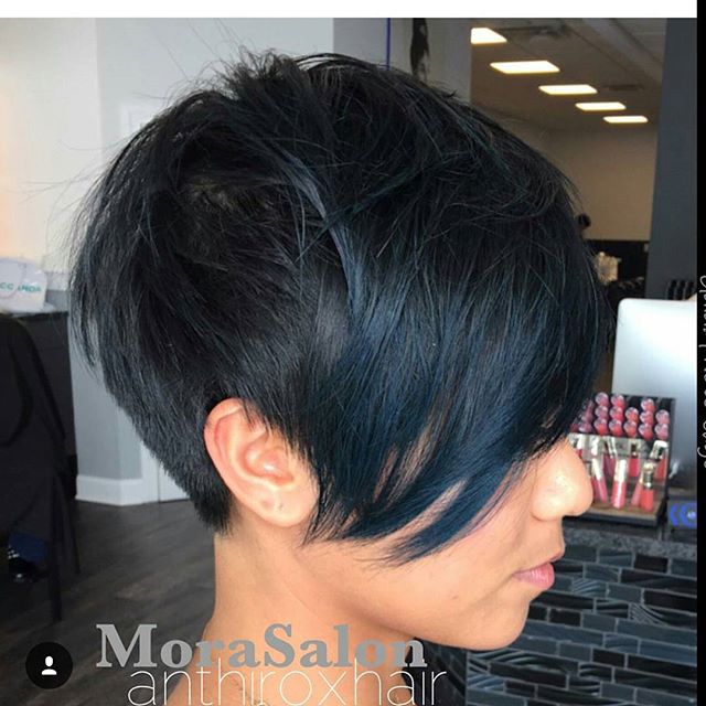 side view of short black pixie cut