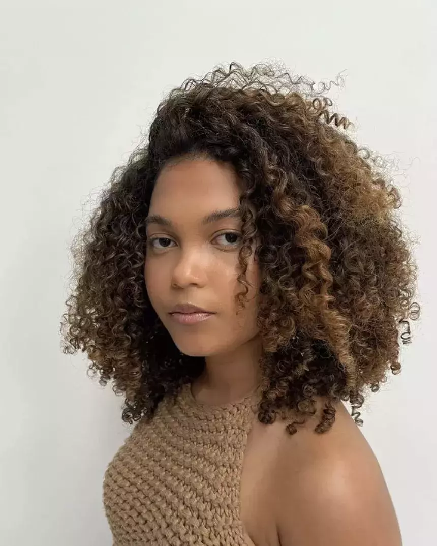 Long Layers on Natural Curls with Deep Side Part